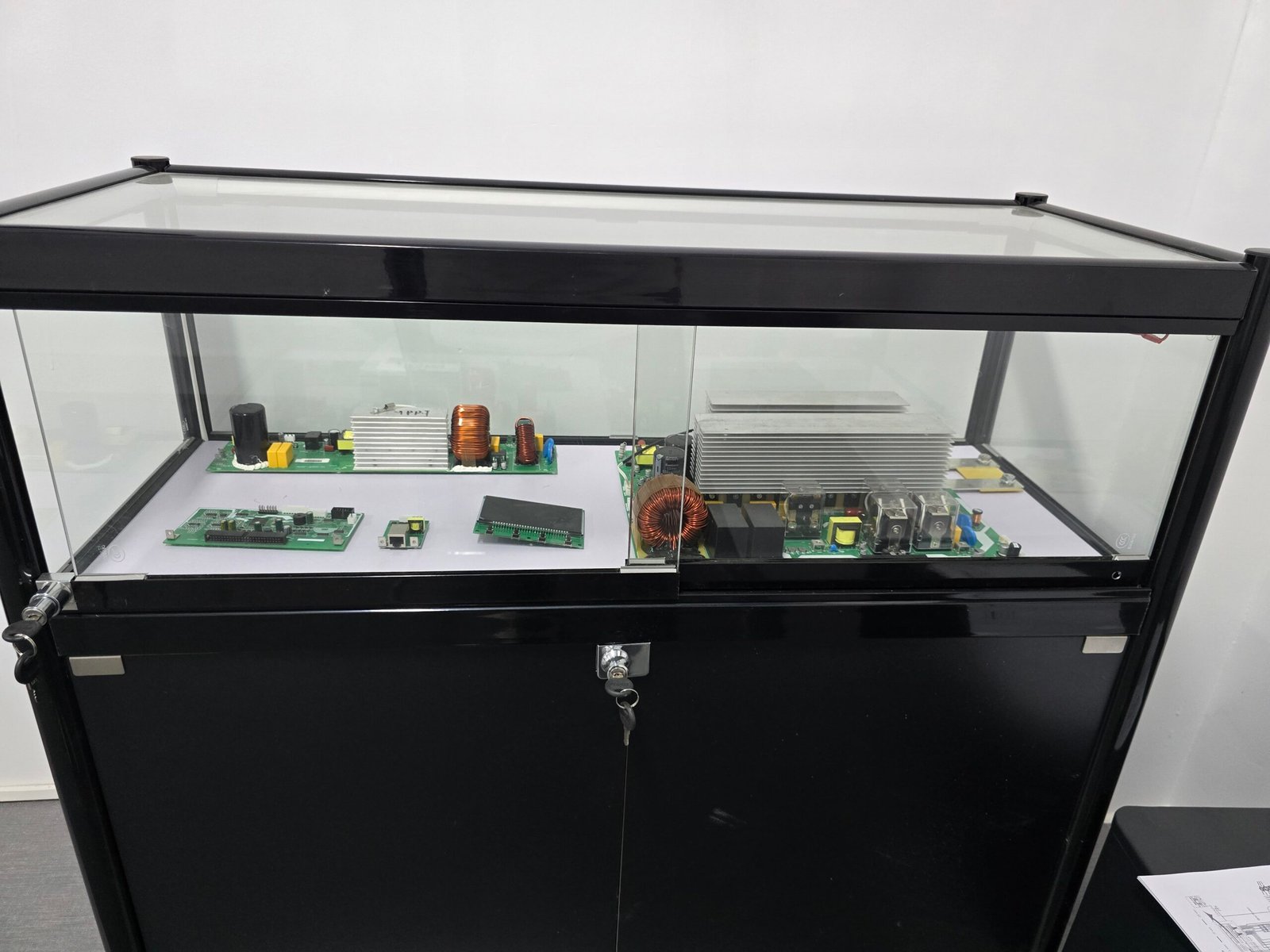 A black hard plastic case with latches and a handle